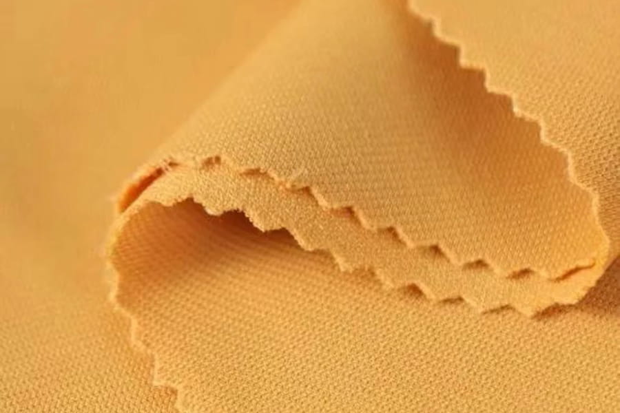 Polyester-Ammonia strikket stoff